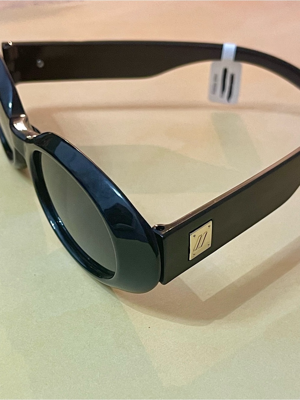 Free People Glossy Black Slim Oval Retro Boho Sunglasses with gold accents - Picture 5 of 15